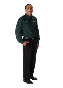 Male associate with forest green, long sleeve Publix shirt, "Serving You Since" name tag  and black pants and shoes.